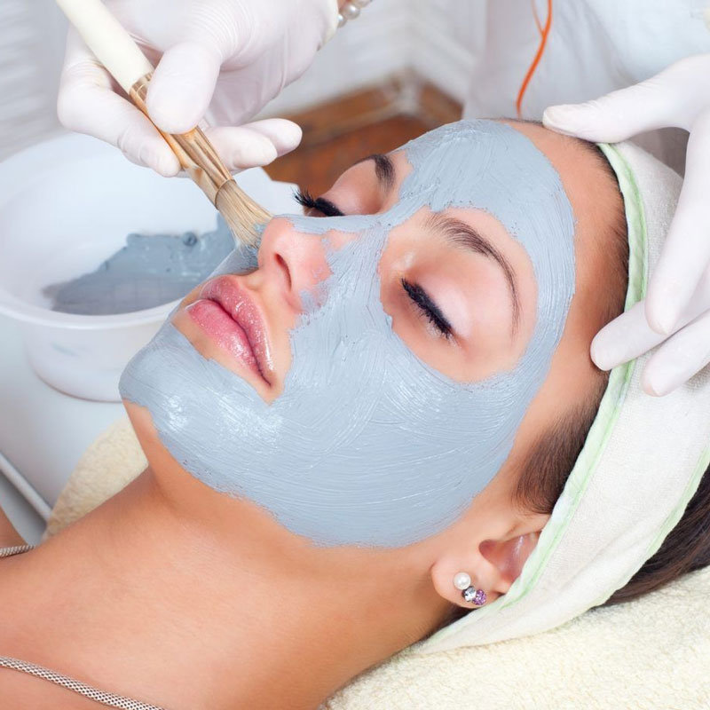lady with face mask on at the spa