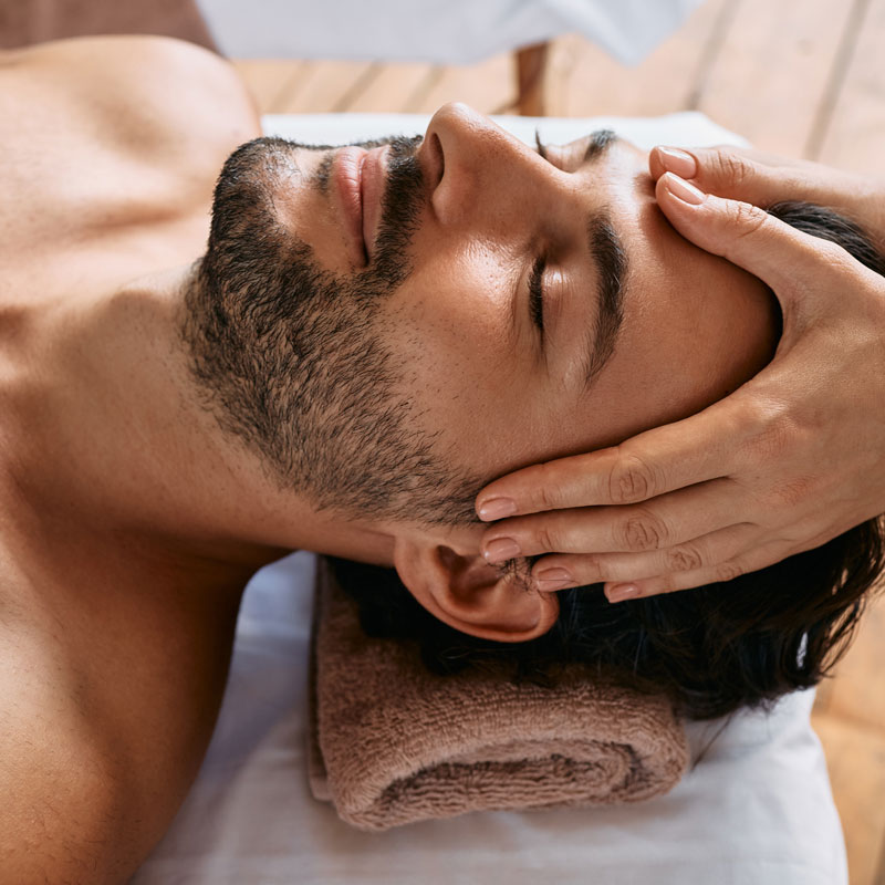 man getting facial massage